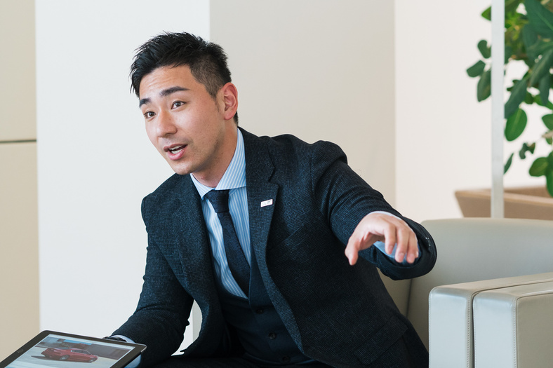 Car Salesperson Talking to Buyers